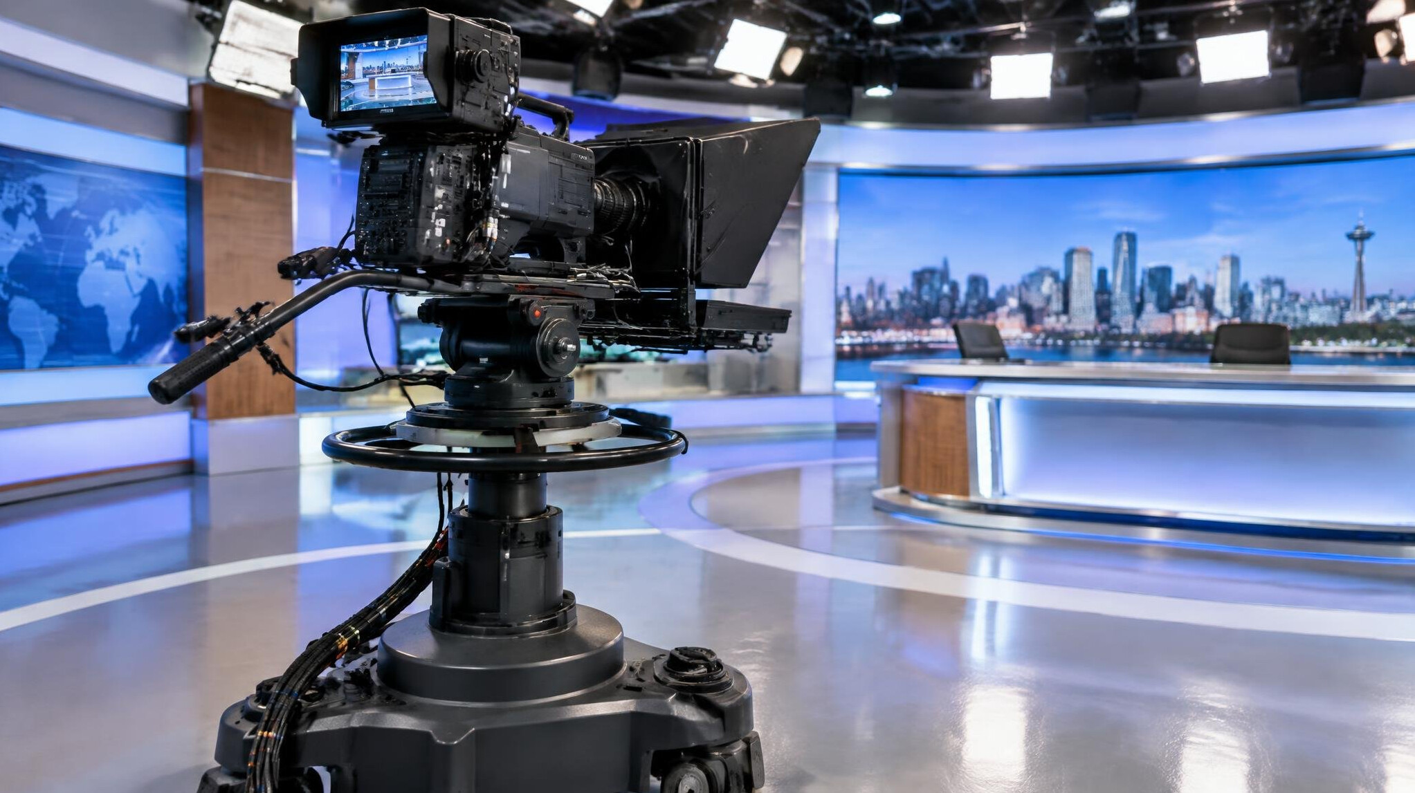 Broadcast camera mounted on a pedestal rig in a television studio